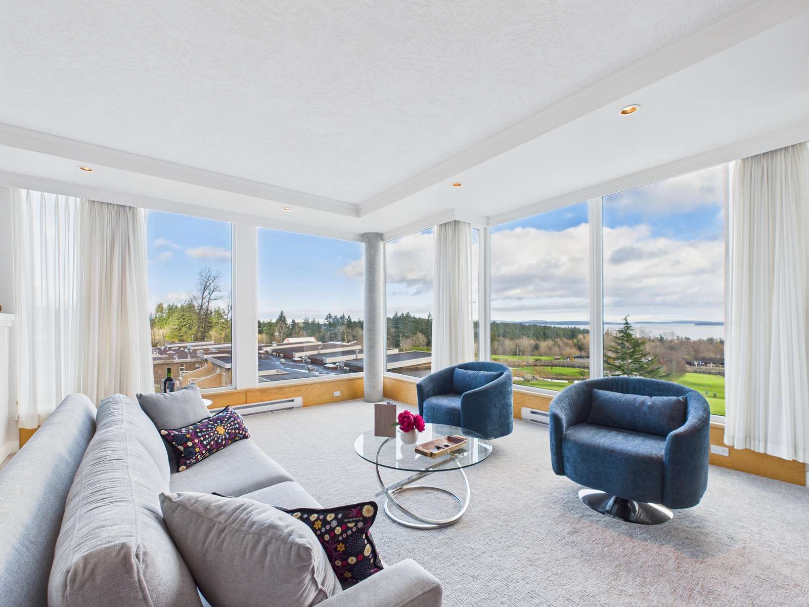 Modern coastal lounge featuring panoramic Haro Strait views. - property