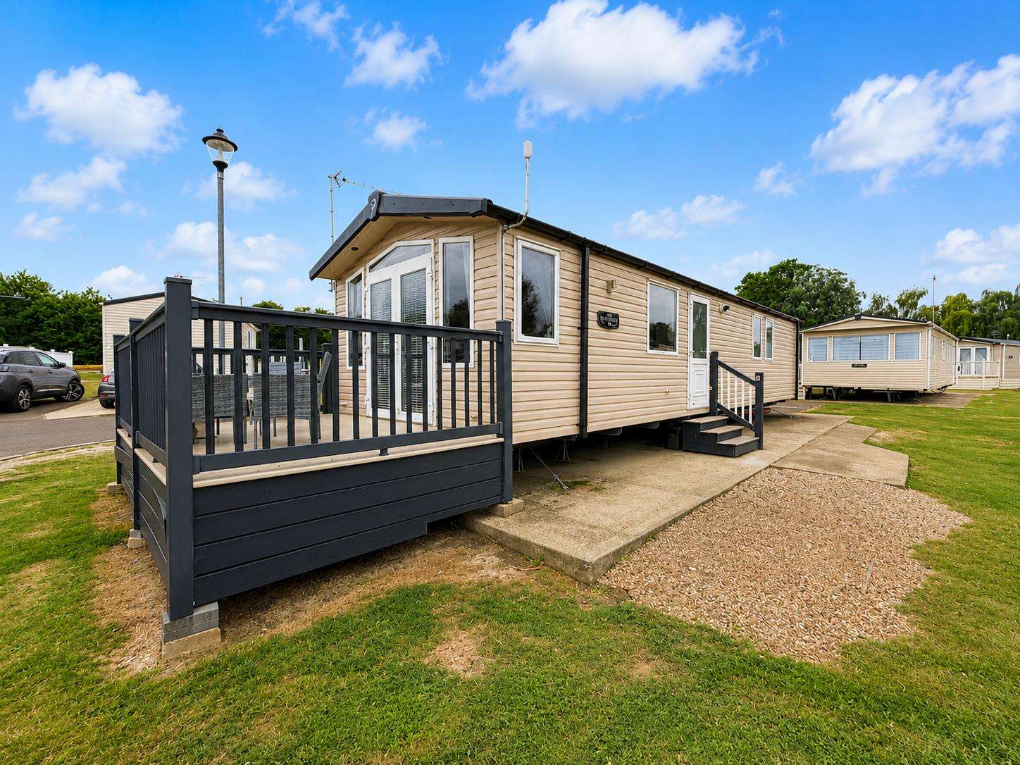 Morning coffee tastes even better from a sunny deck. Relax and watch the world go by on your own private decking. - property