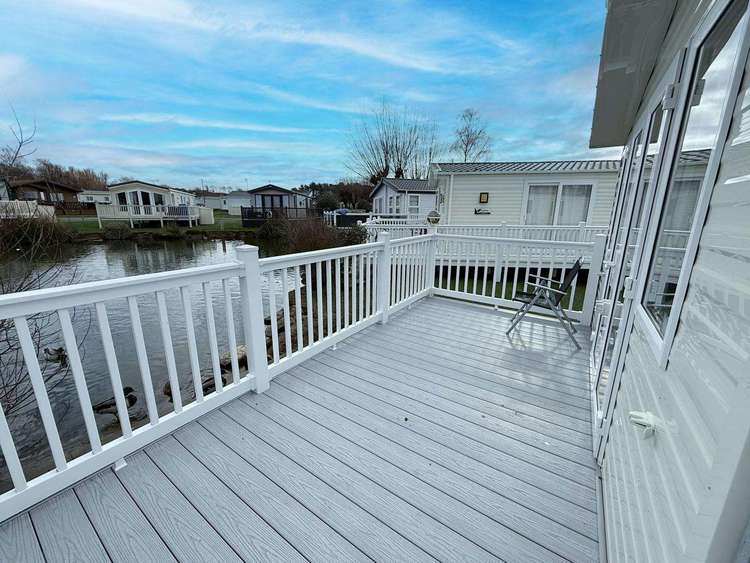 23056K⛱️ – Kensington area, 3 bed, 8 berth caravan with full decking and pond views. Opal rated. Preview 0