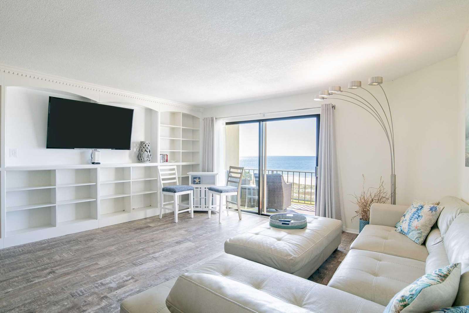 Bright living room with ocean views and cozy seating - property