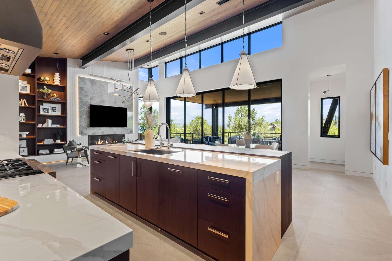 Modern kitchen with panoramic windows and sleek island seating