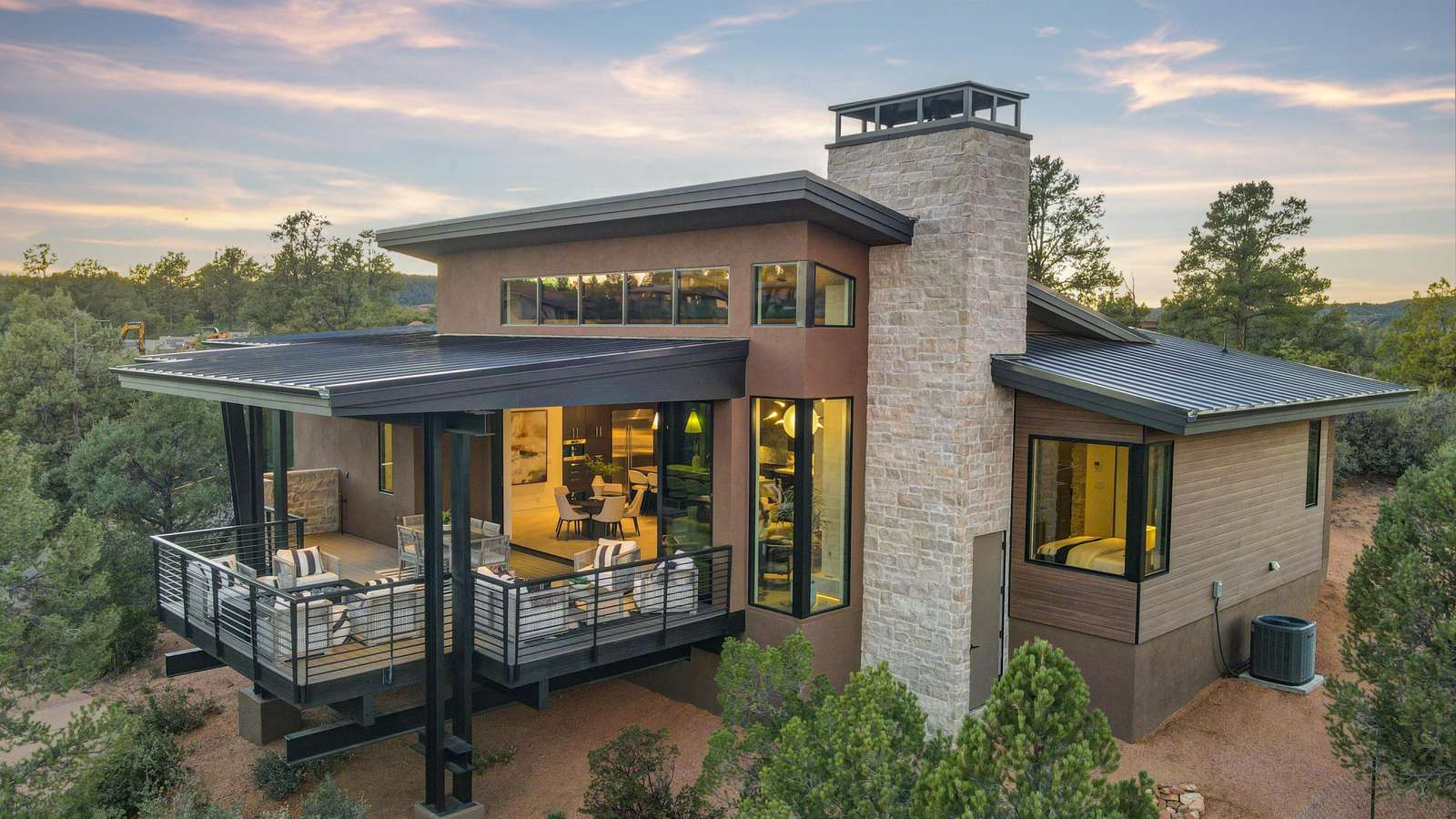 Modern home with panoramic forest views and cozy fireplace