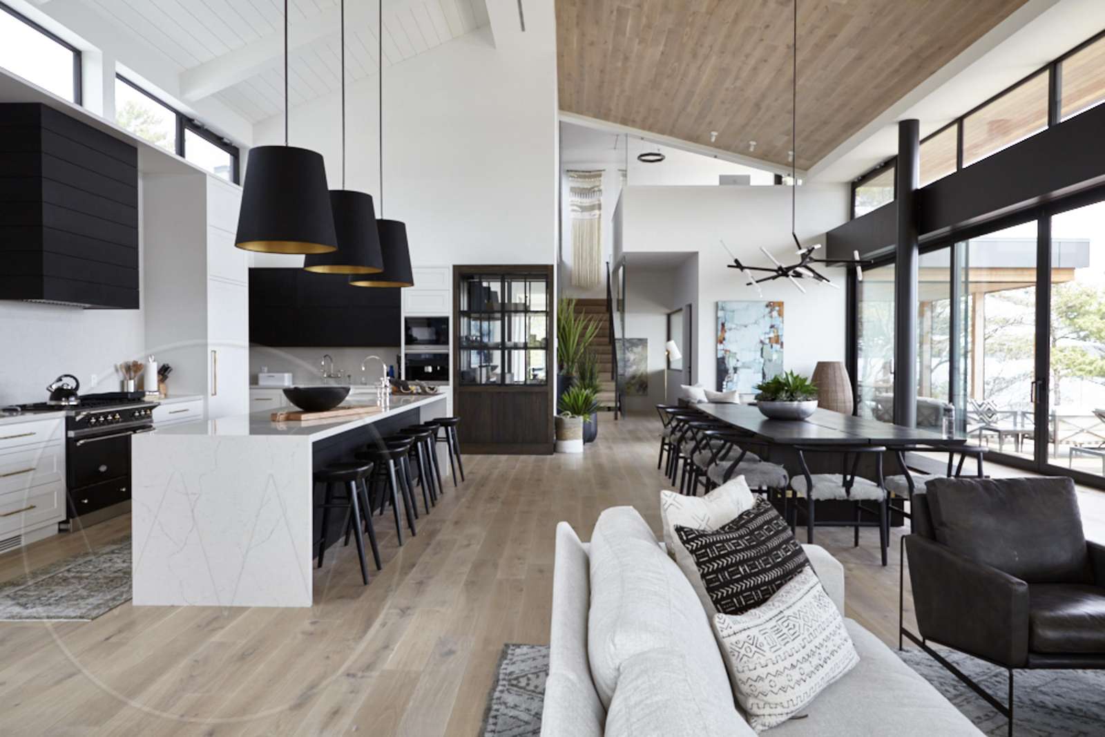 Spacious open-concept living and dining with panoramic windows