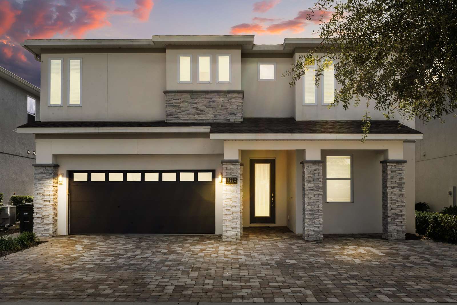 Modern two-story home with spacious three-car garage and elegant entryway - property