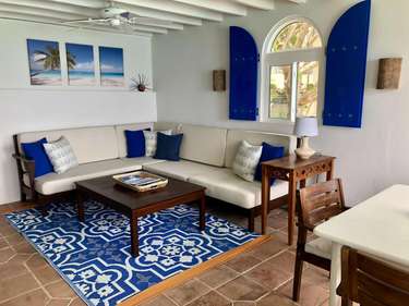 Cozy living room with vibrant Mediterranean charm and natural light