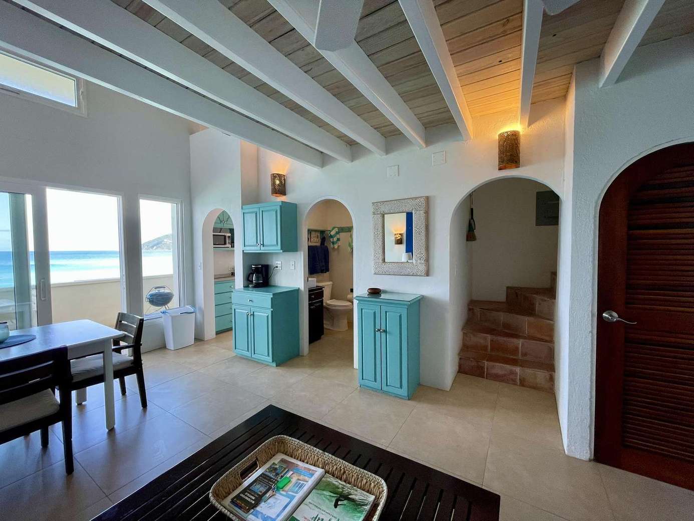 Cozy living room with ocean views and rustic charm