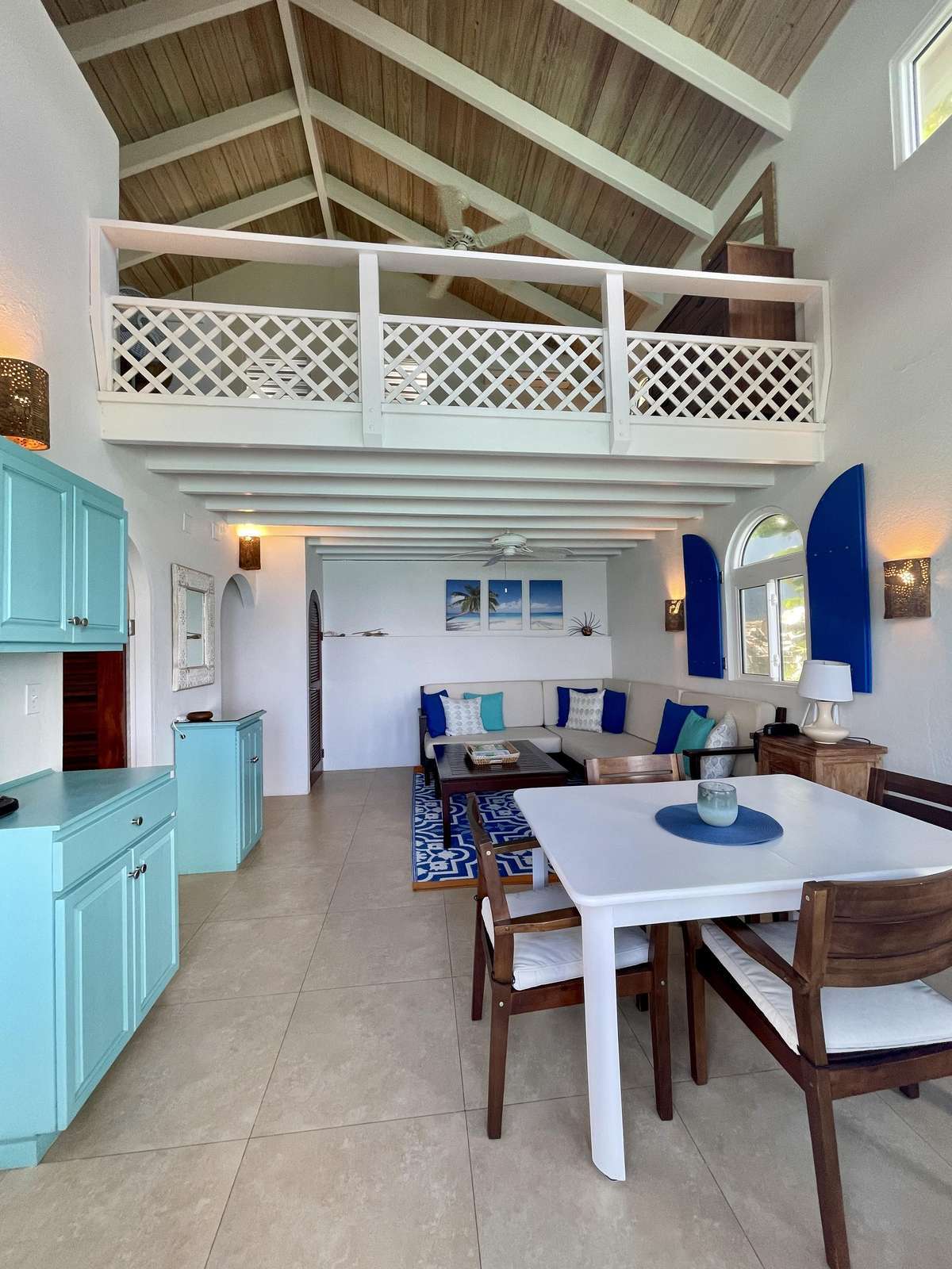 Spacious dining and living area with vaulted ceilings and loft retreat