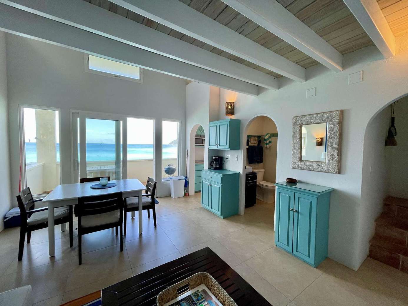 Bright dining area with ocean views and coastal charm