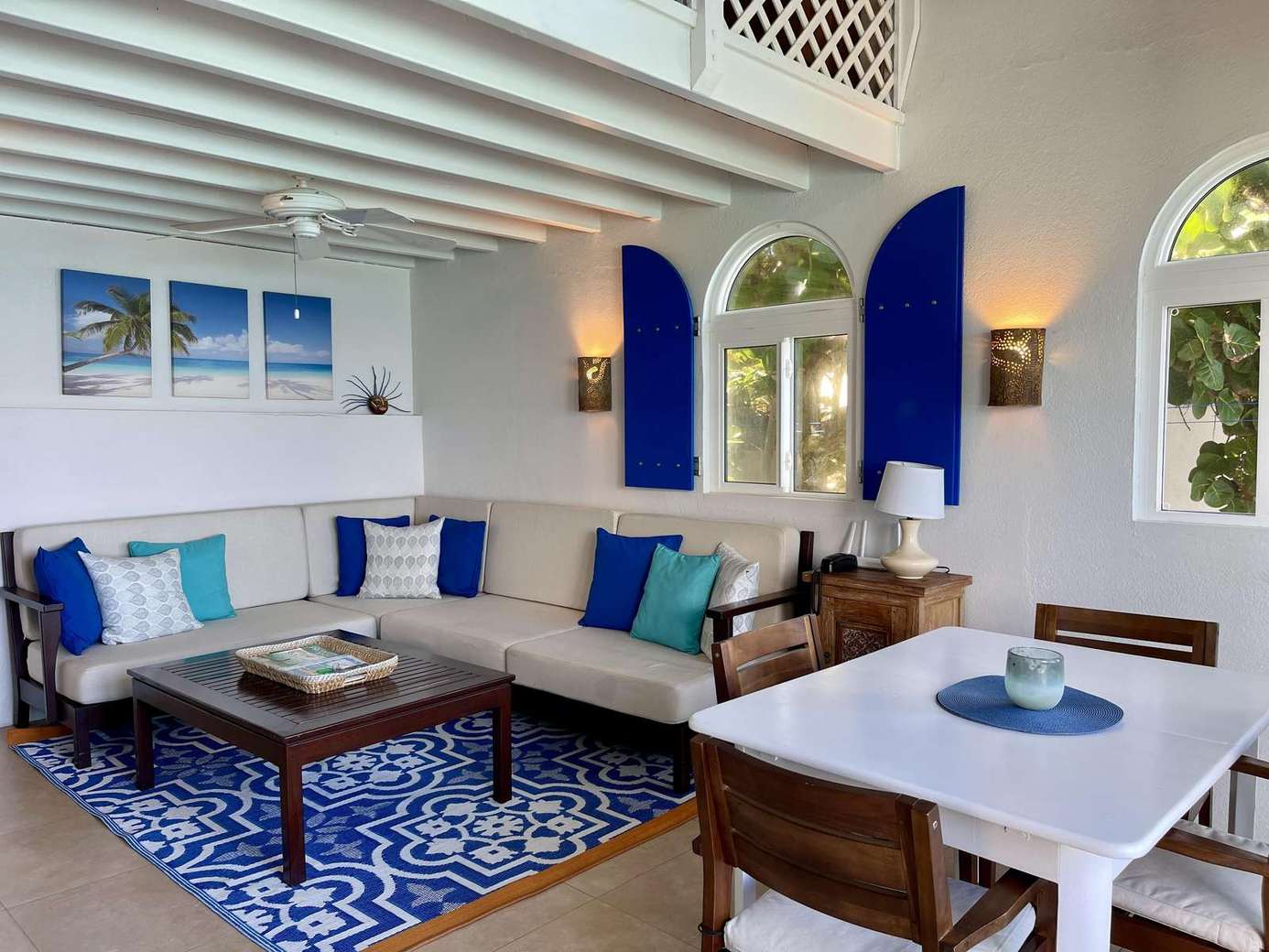 Cozy living room with vibrant blue accents and natural light