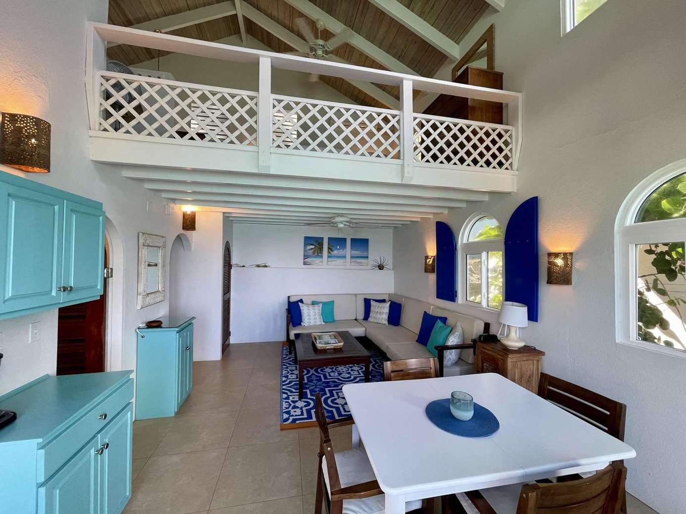 Spacious open-concept living and dining area with loft view