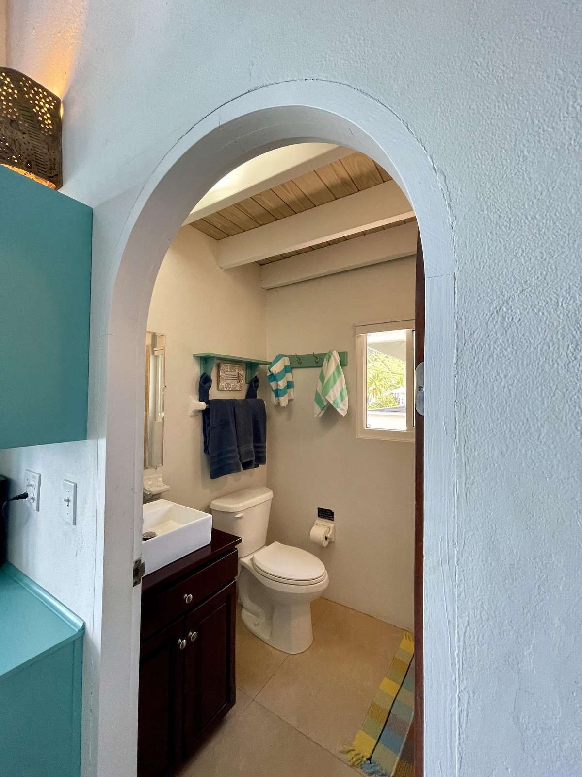 Charming bathroom with rustic archway and natural light