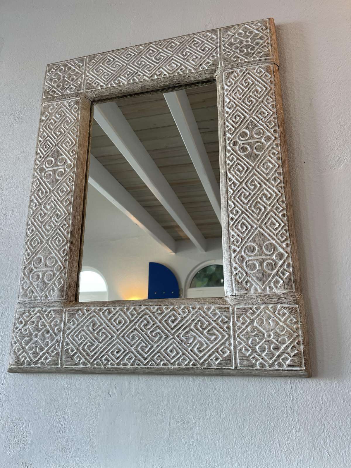 Intricately carved mirror adding charm to your space