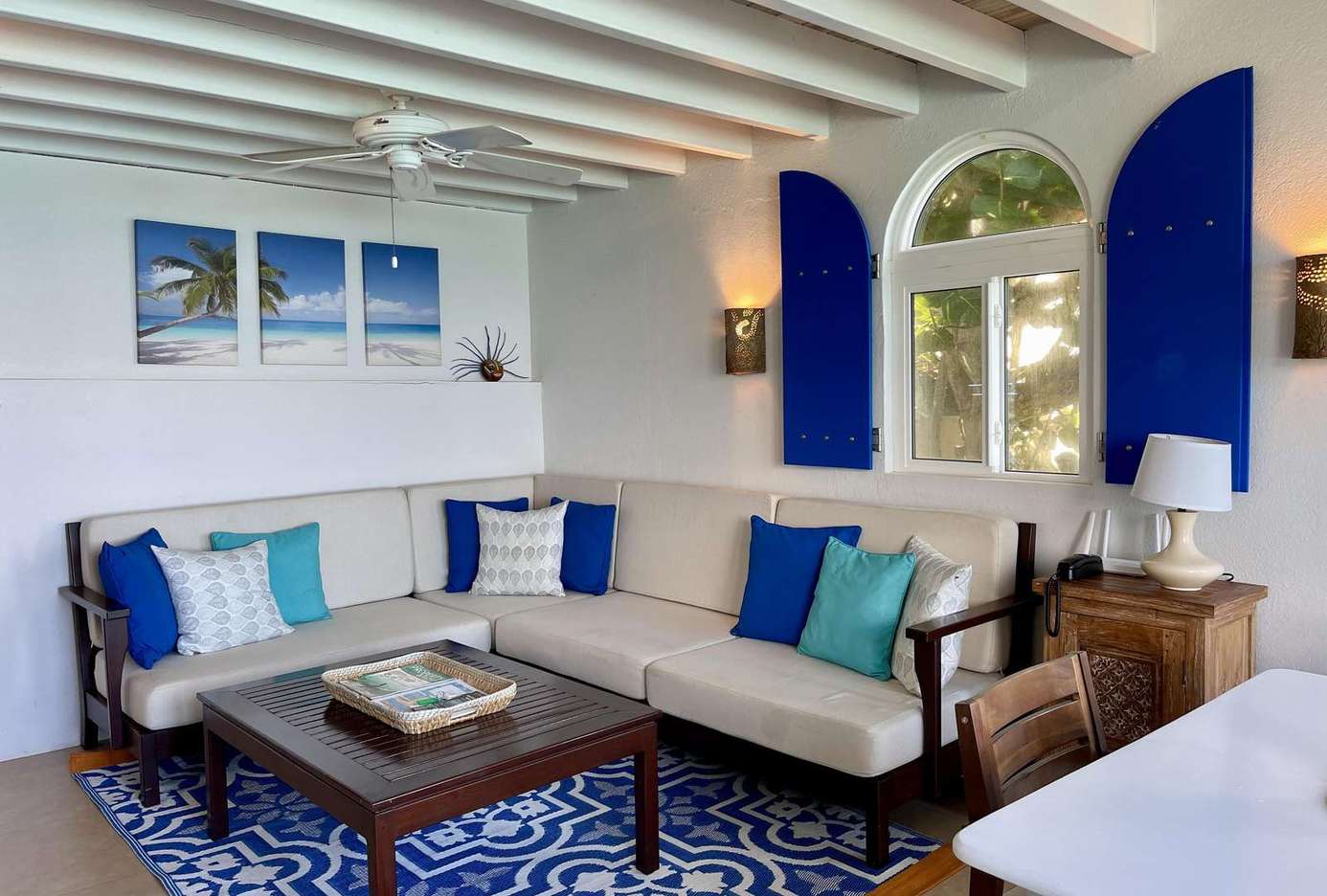 Cozy living room with vibrant blue accents and natural light