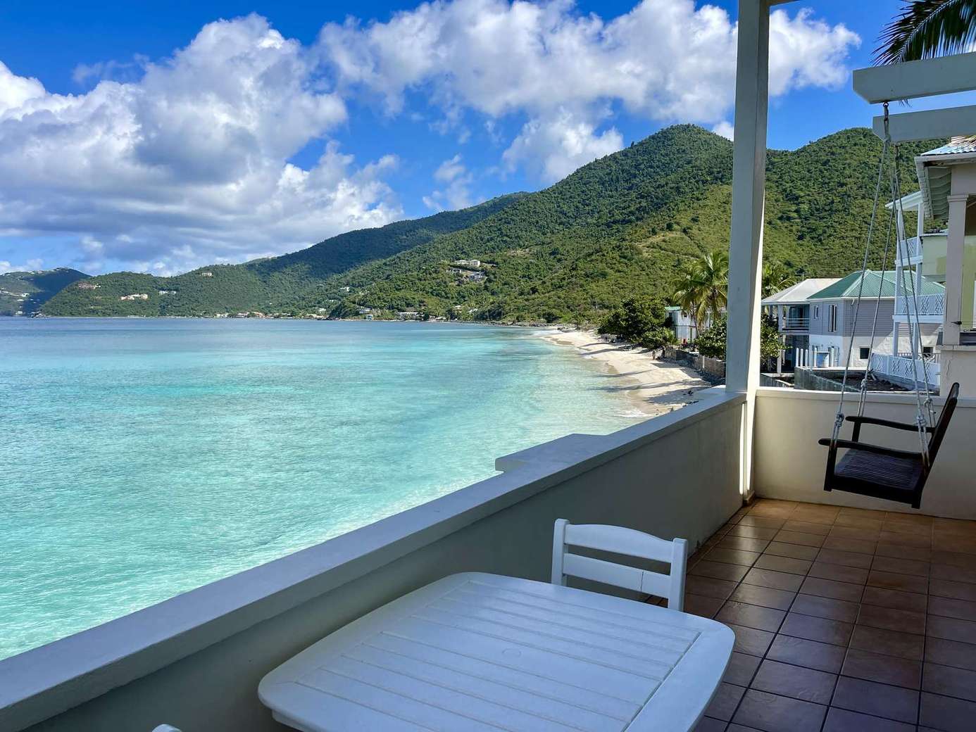 Oceanfront balcony with stunning turquoise views and fresh sea breeze