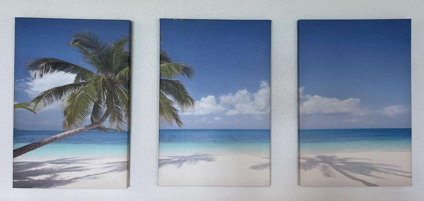 Serene beach view artwork sets a tranquil vacation tone