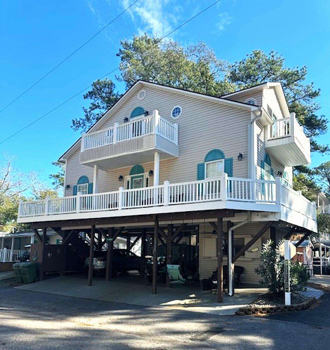 Spacious elevated home with expansive wraparound deck - property