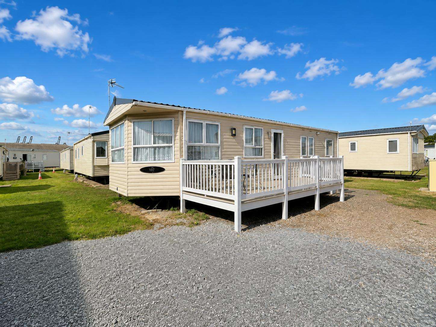 Relax and unwind in this beautiful caravan located on Felixstowe Beach in Suffolk. You'll love the decking to enjoy the sunshine on. - property