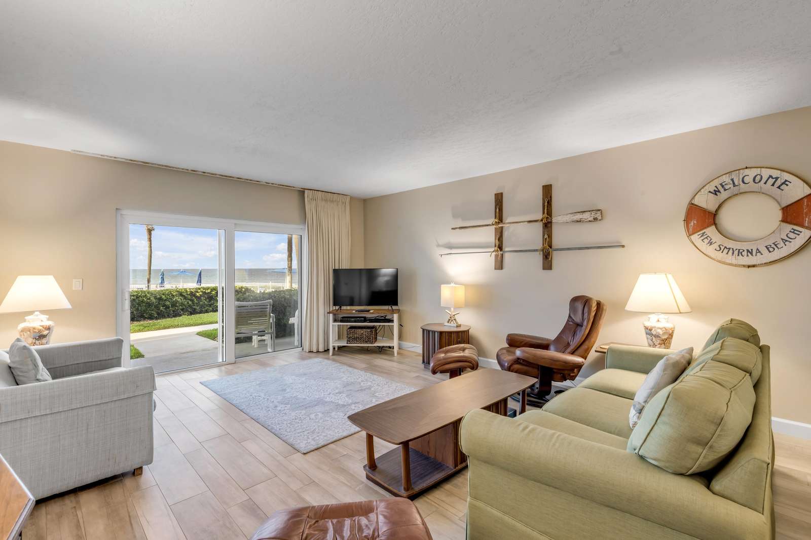 Spacious living room with cozy seating and scenic views - property