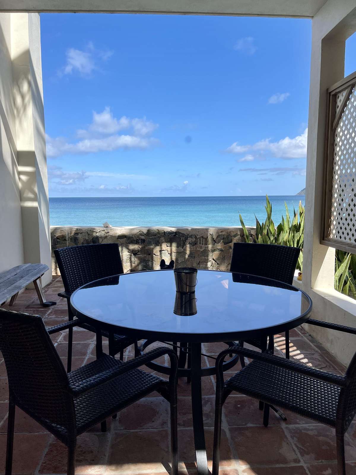 Cozy balcony dining with stunning ocean views