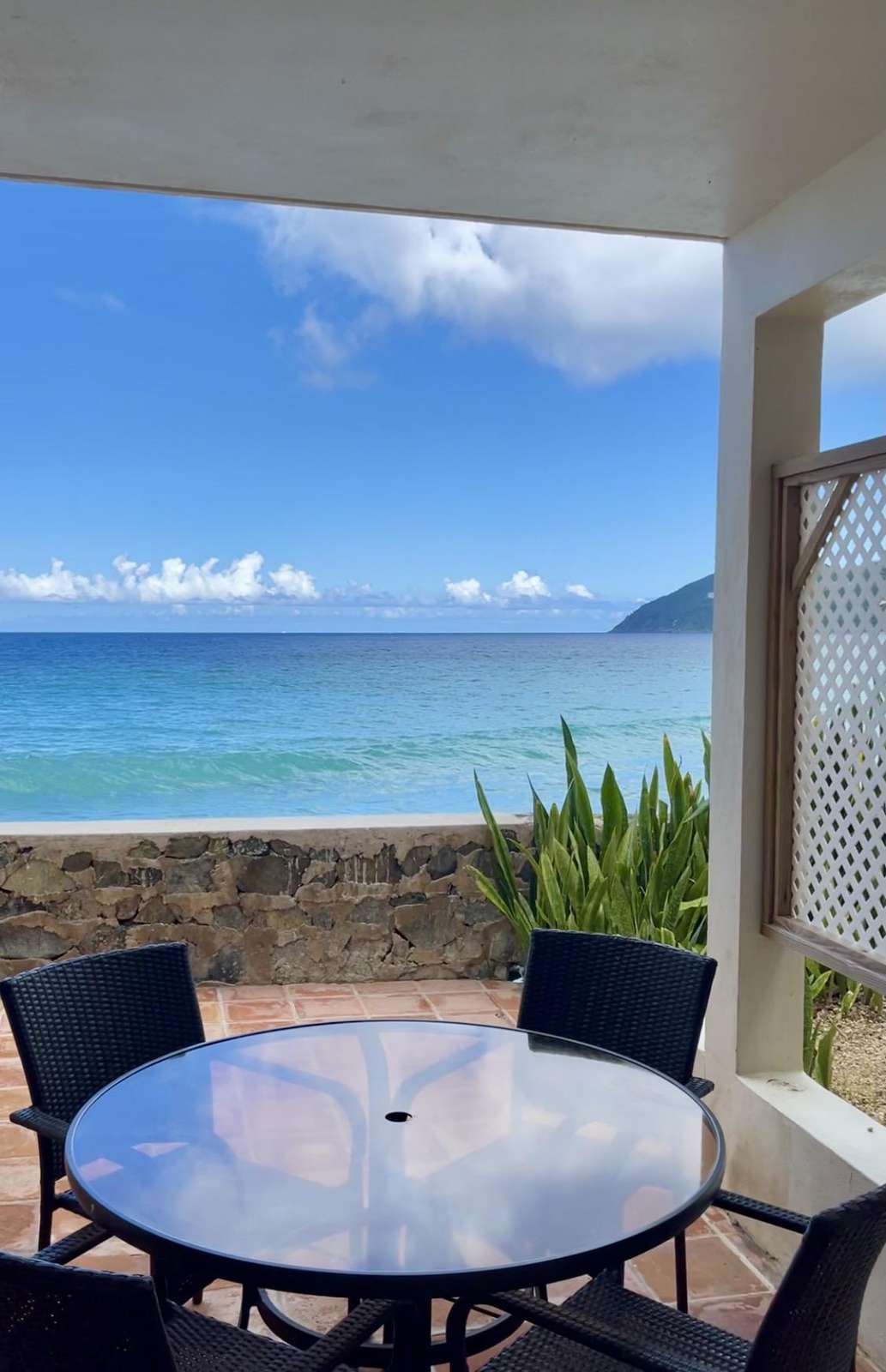 Oceanfront patio with stunning sea views and cozy seating