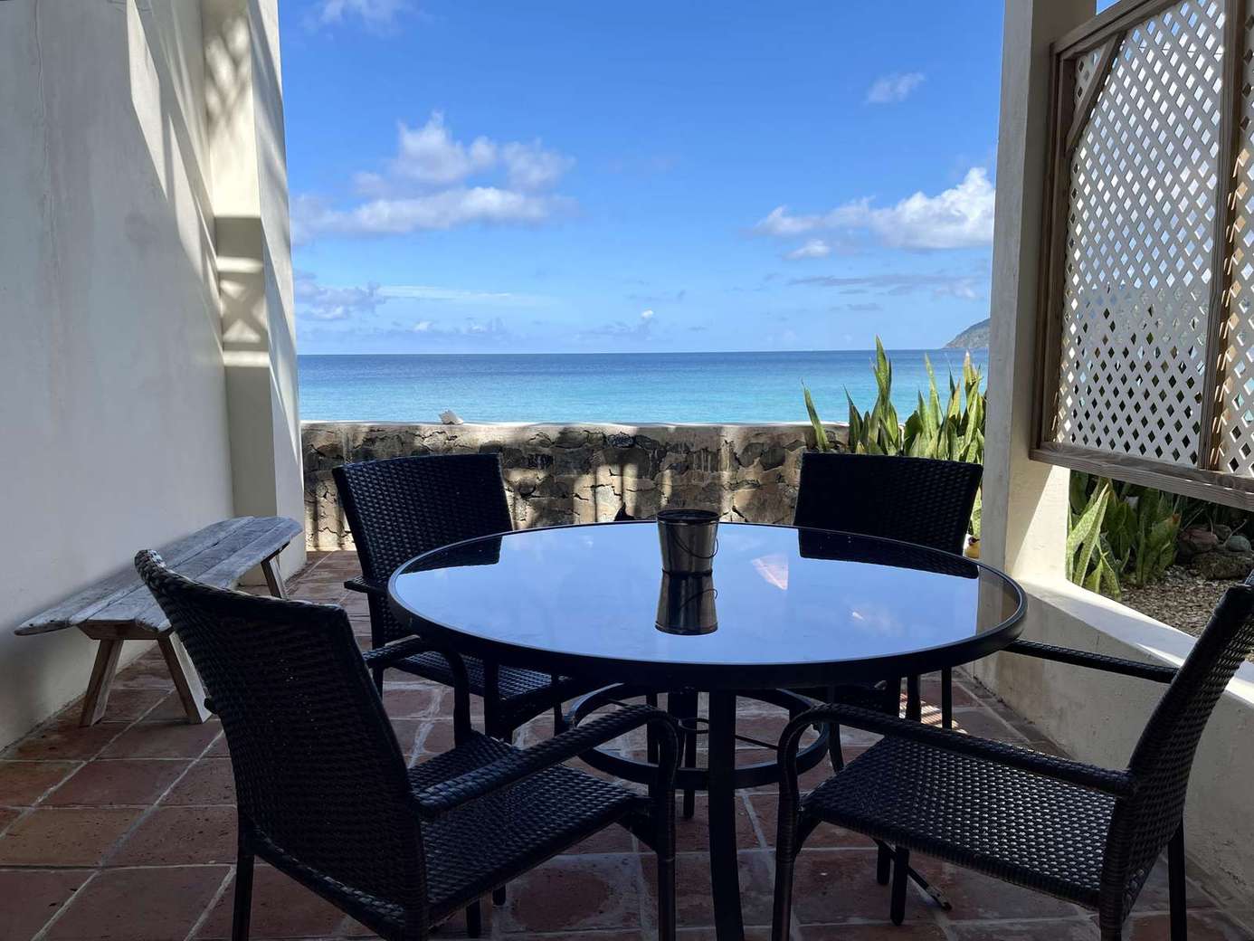 Cozy oceanfront patio with stunning sea views and breeze