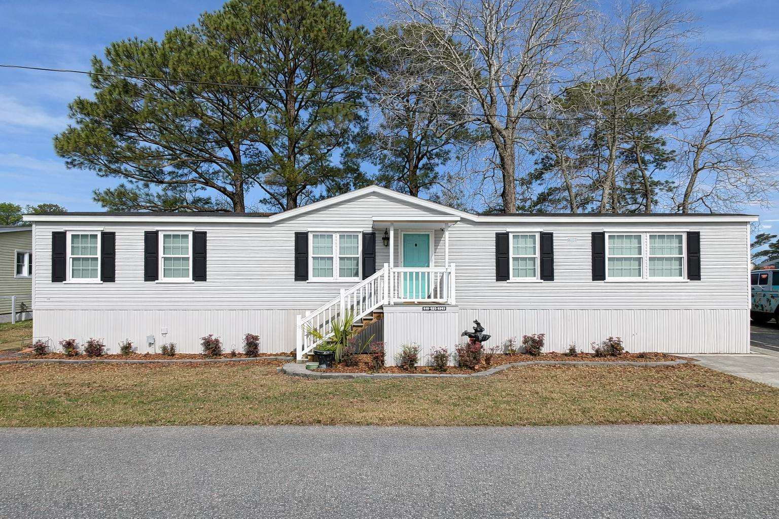 Bright and spacious exterior with charming curb appeal - property