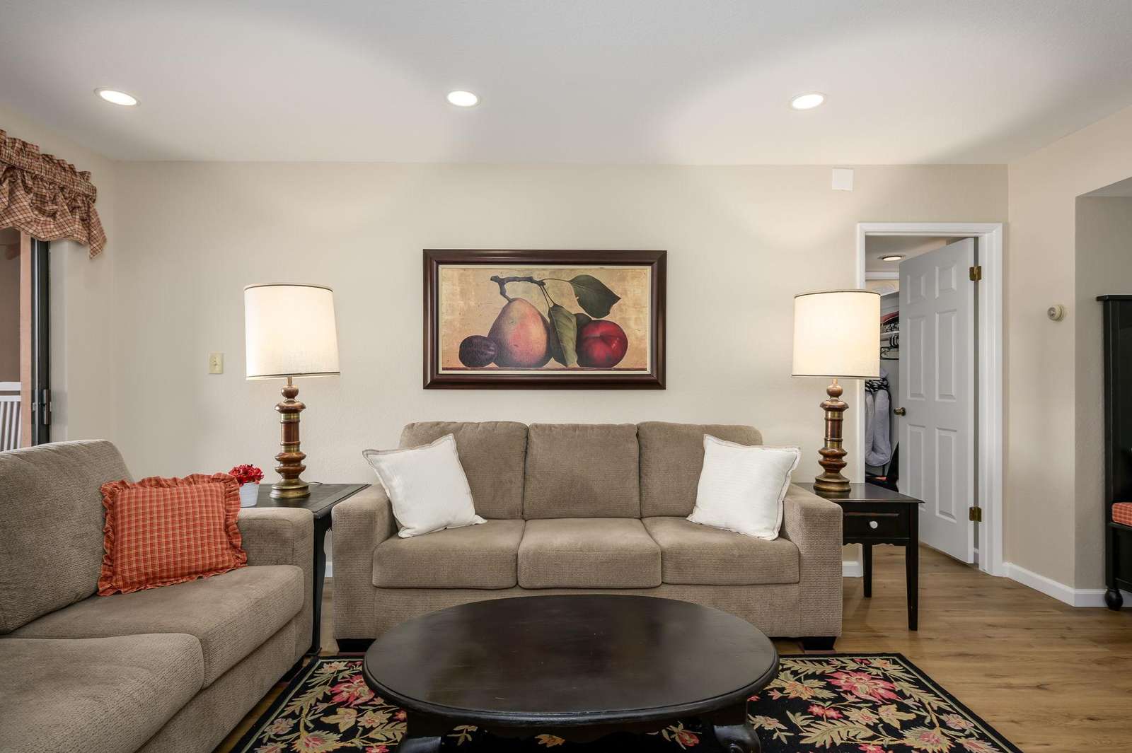 Cozy living room with warm lighting and stylish decor - property