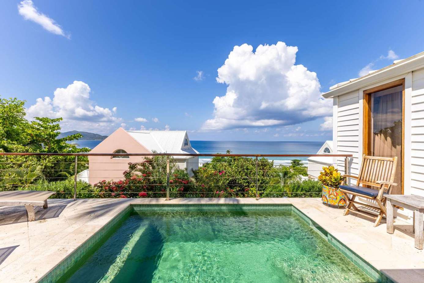 Private pool oasis with ocean views and cozy seating