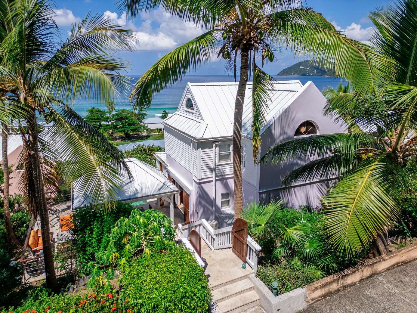 Tropical oasis with lush gardens and serene patio retreat