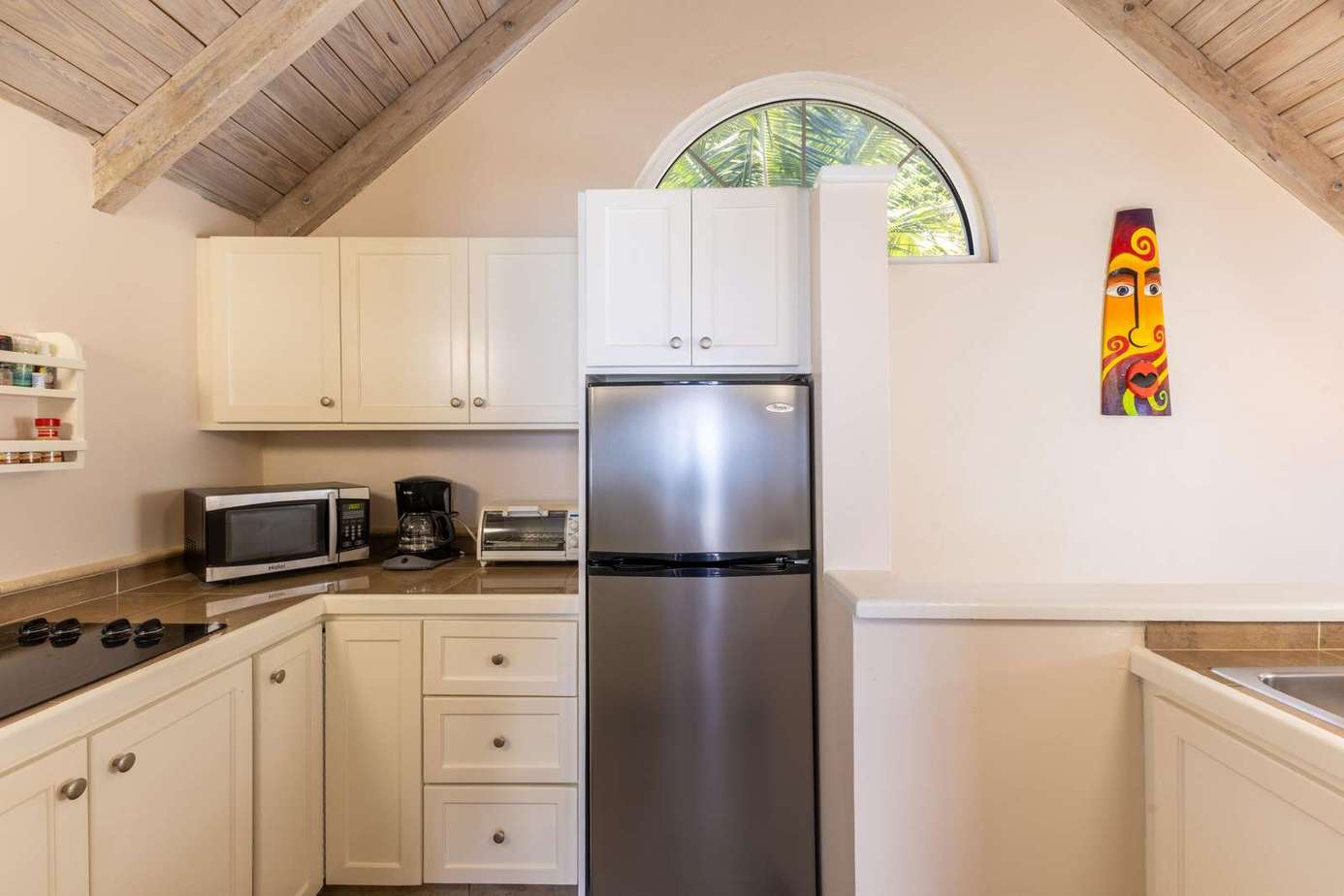 Bright, airy kitchen with vaulted ceilings and modern appliances