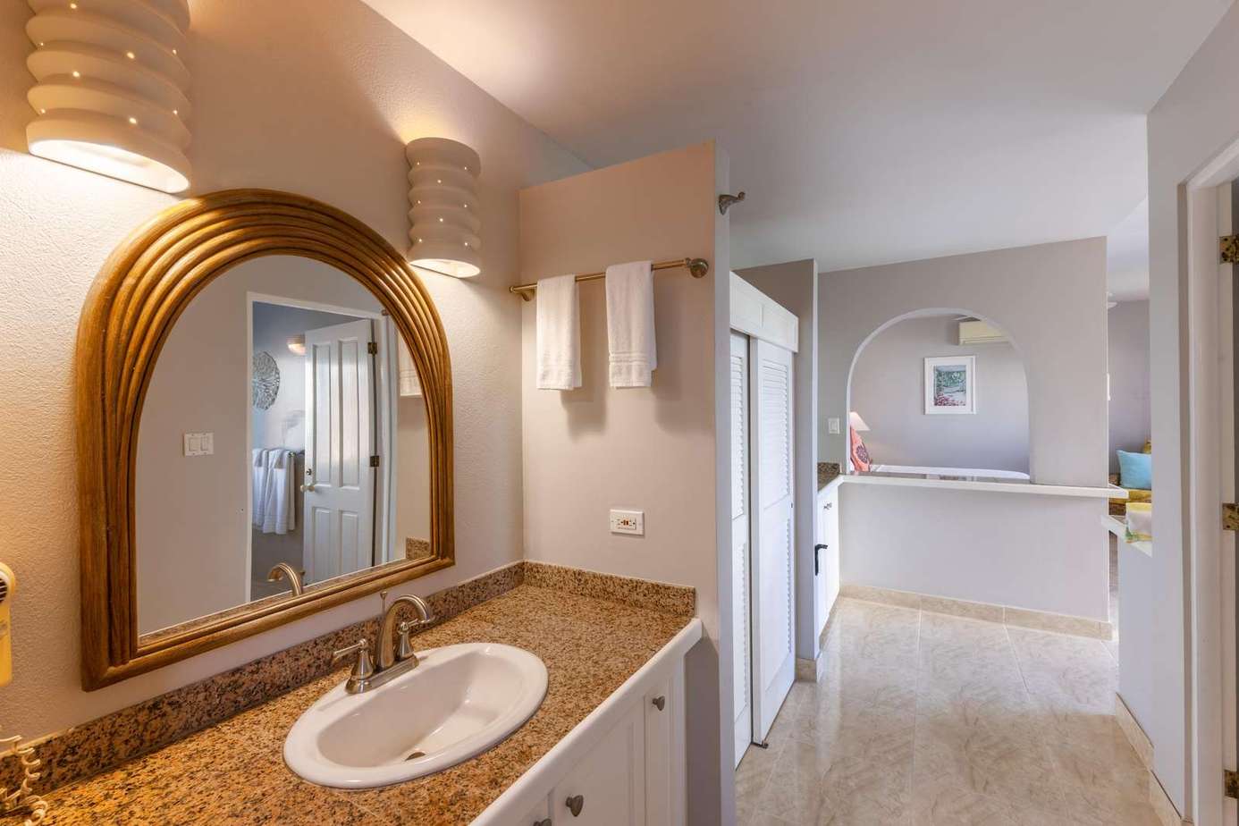 Bright and airy bathroom with elegant granite countertop