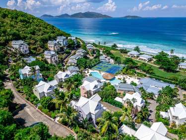 Oceanfront villas with lush greenery and stunning beach views