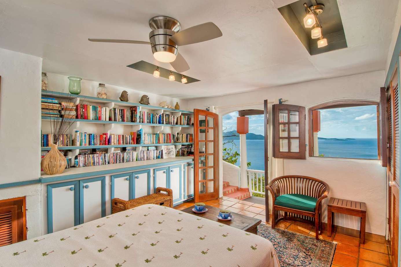 Cozy bedroom with ocean views and a private balcony