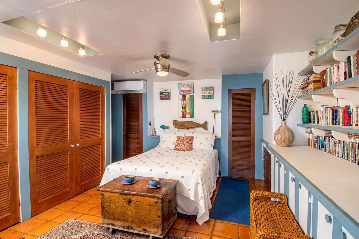 Cozy bedroom retreat with charming built-in bookshelves and warm wood accents