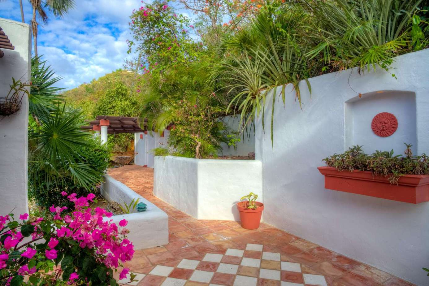 Charming courtyard with vibrant blooms and cozy seating
