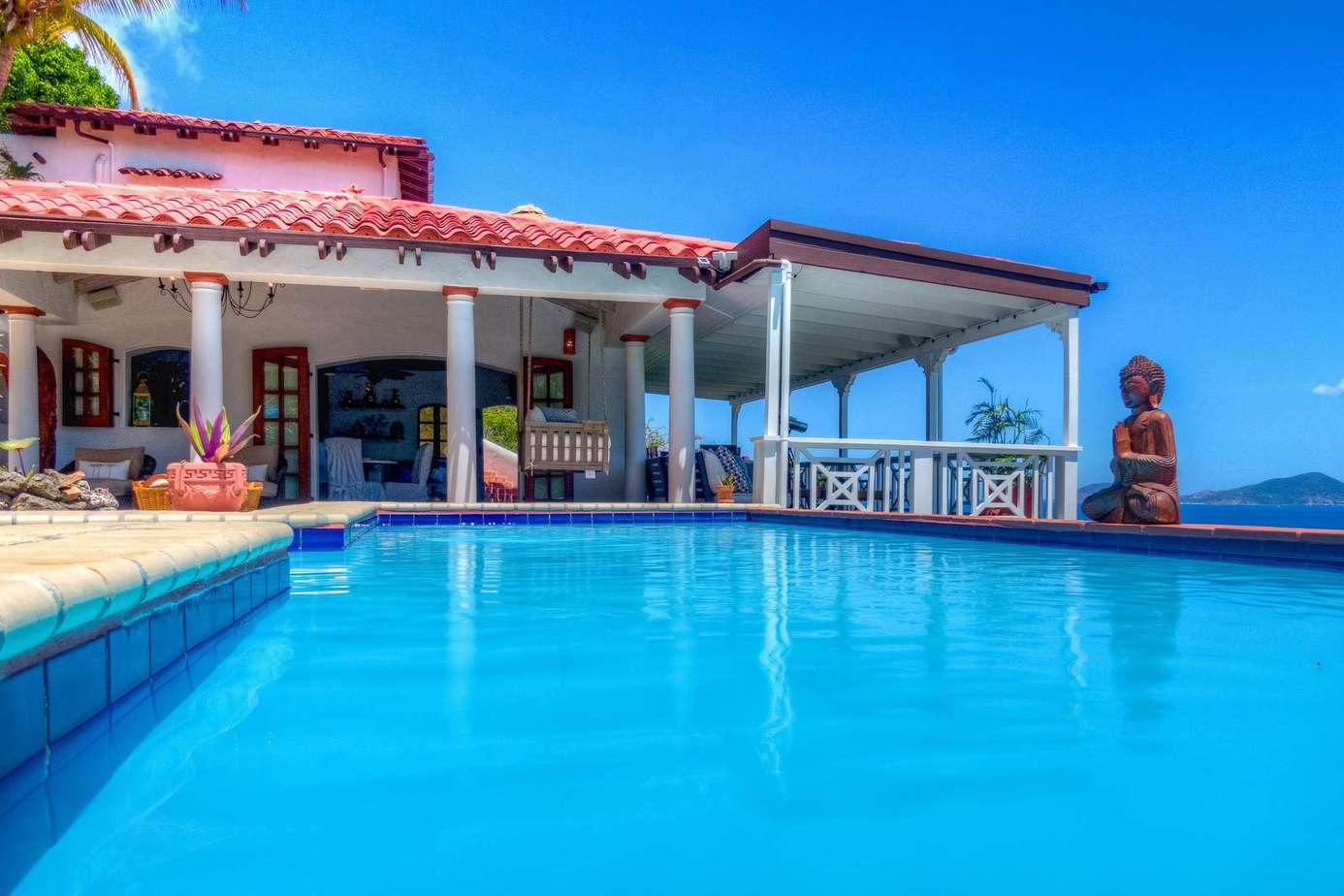 Expansive poolside patio with stunning ocean views