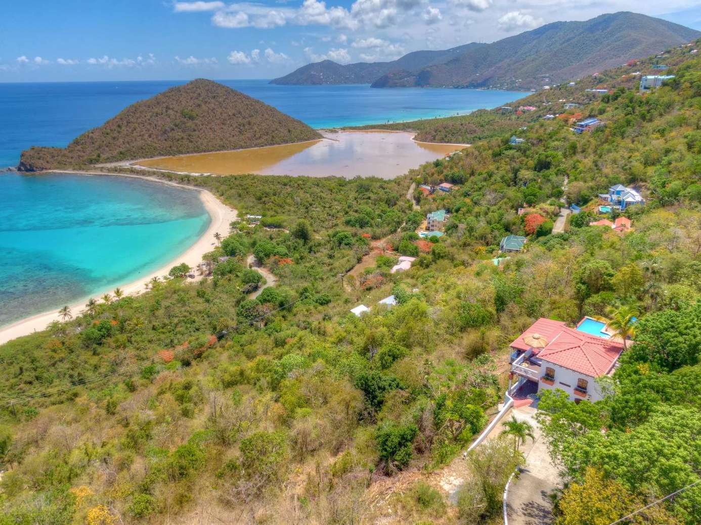 Secluded hillside retreat with stunning ocean views and private beach access