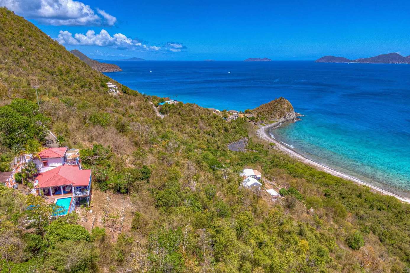 Secluded hillside retreat with stunning ocean views and vibrant sunsets