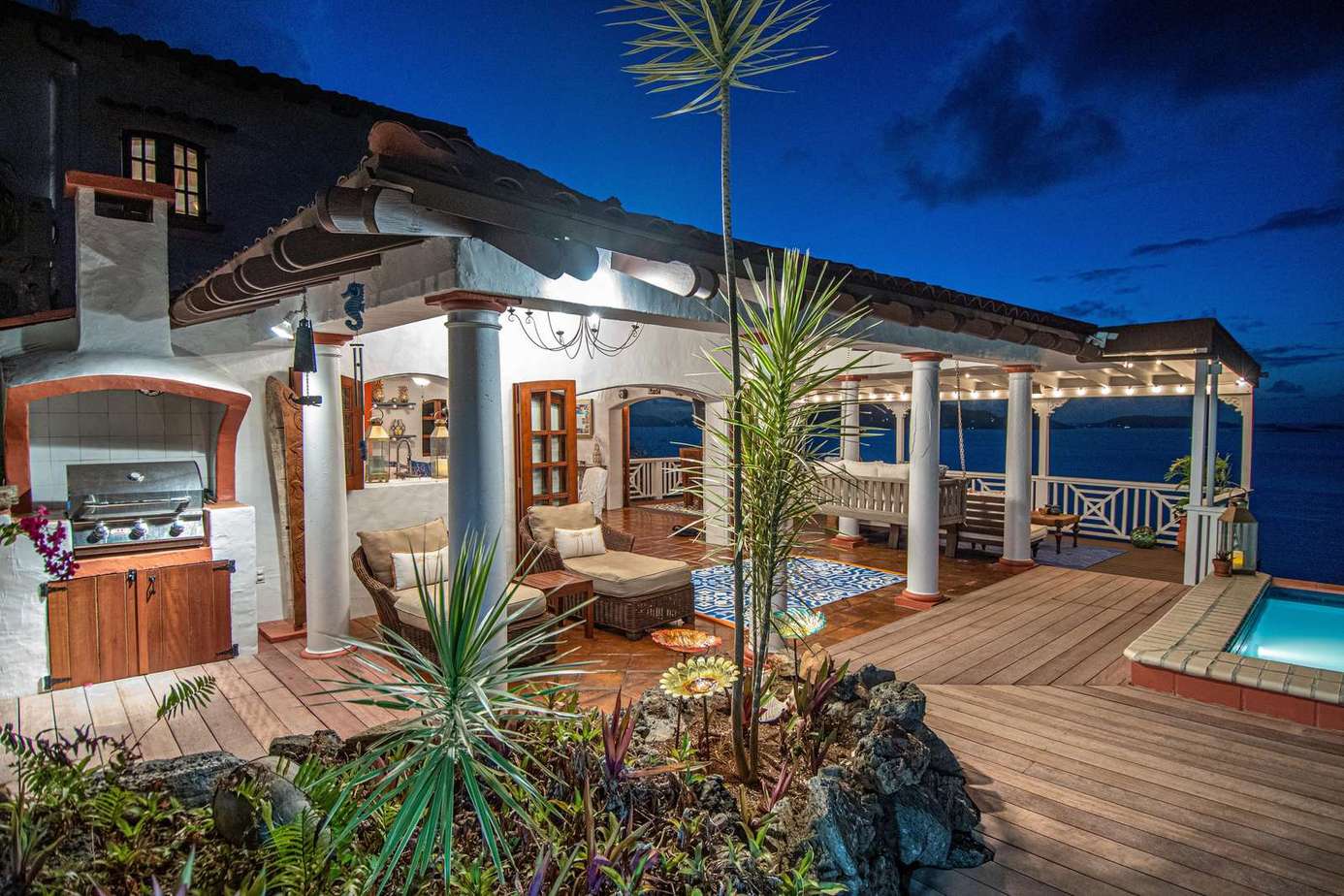 Spacious outdoor deck with ocean views and cozy seating