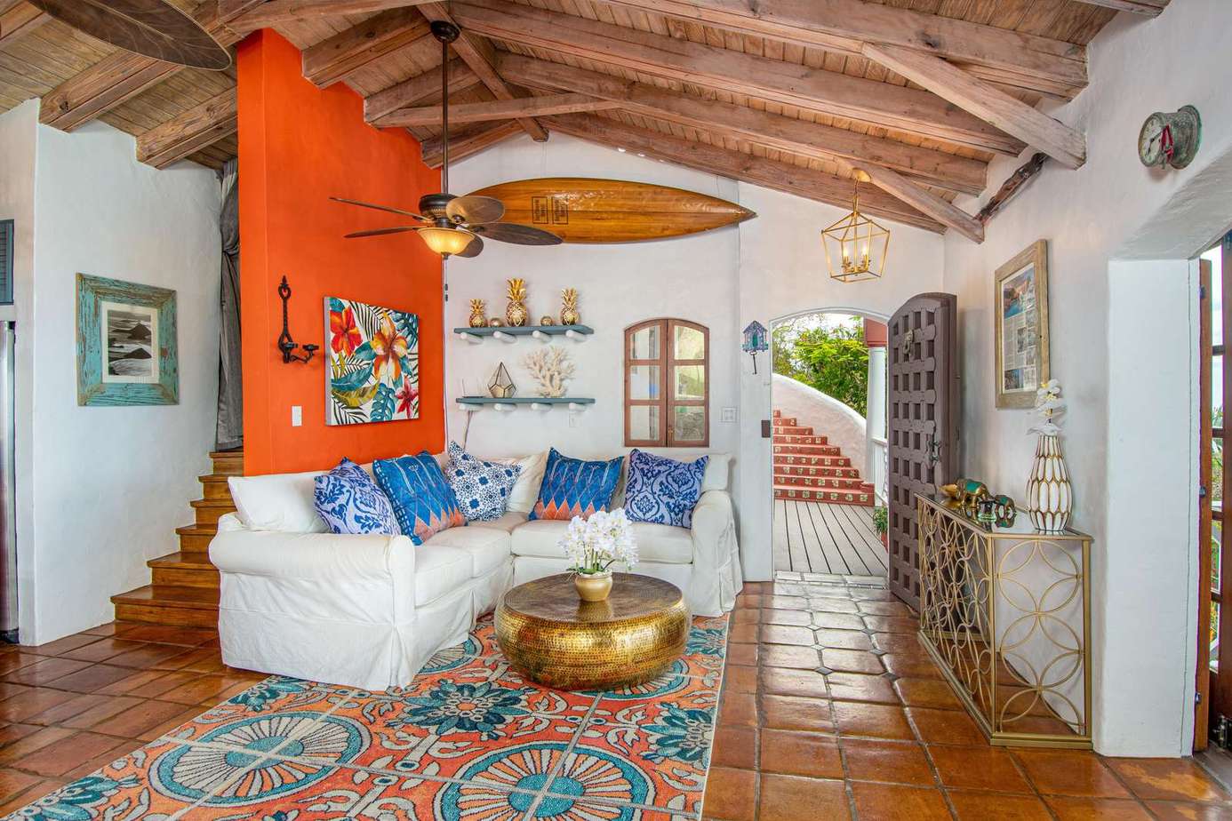 Cozy living room with vibrant art and rustic charm