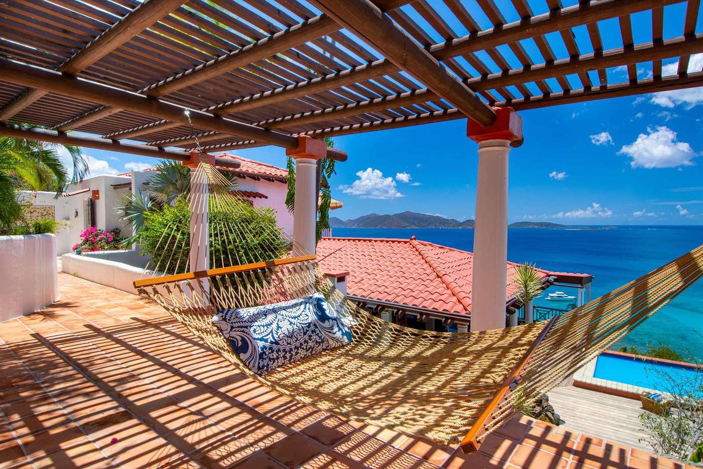 Ocean-view patio with shaded hammock for ultimate relaxation