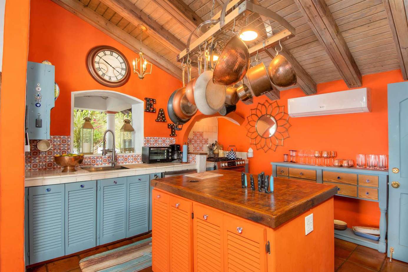 Vibrant kitchen with rustic charm and spacious island