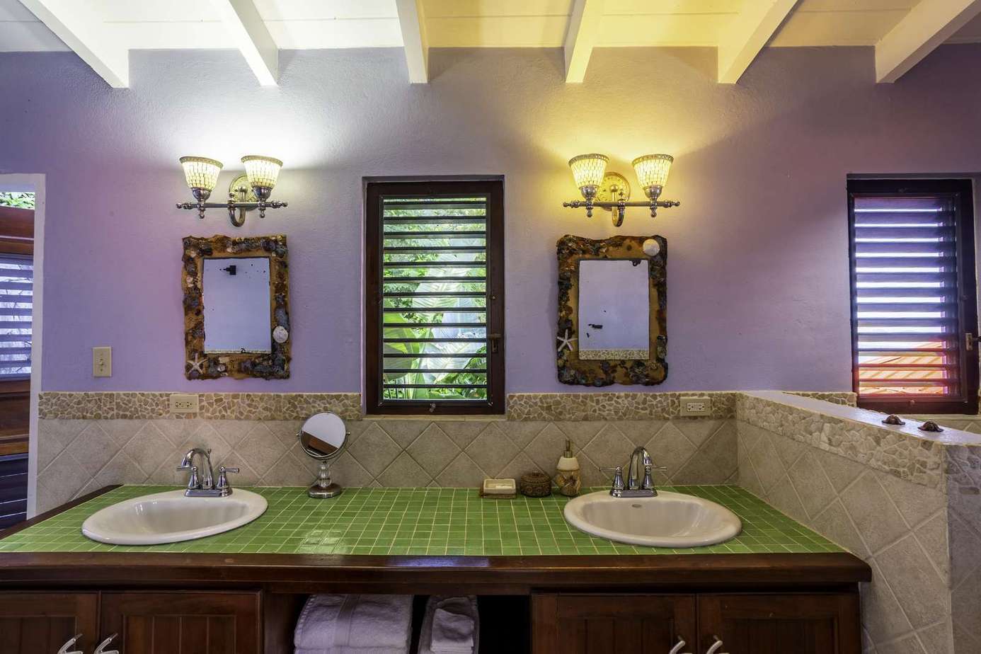 Charming bathroom with dual sinks and warm lighting