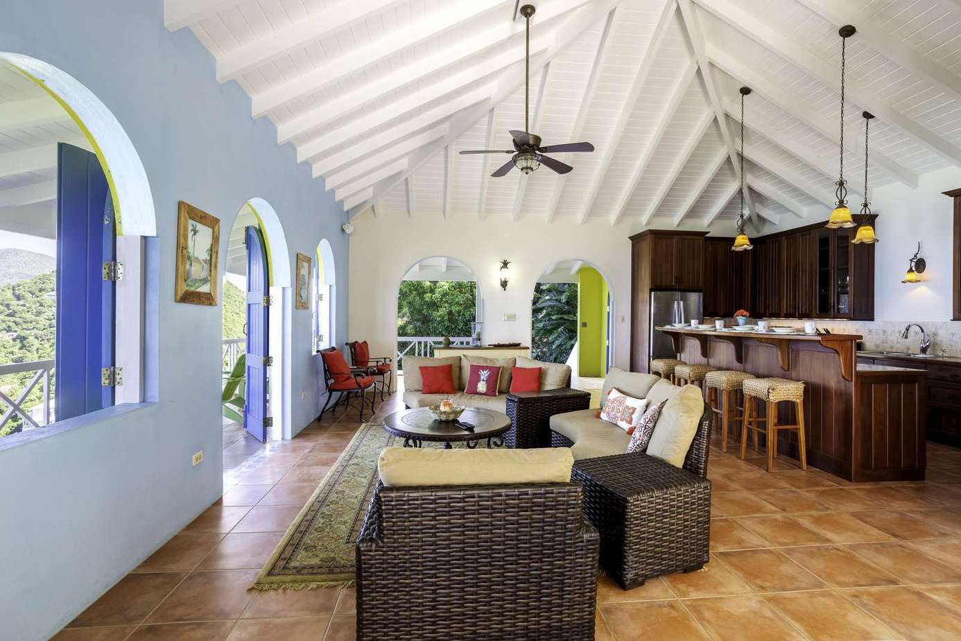 Spacious living room with vaulted ceilings and open kitchen