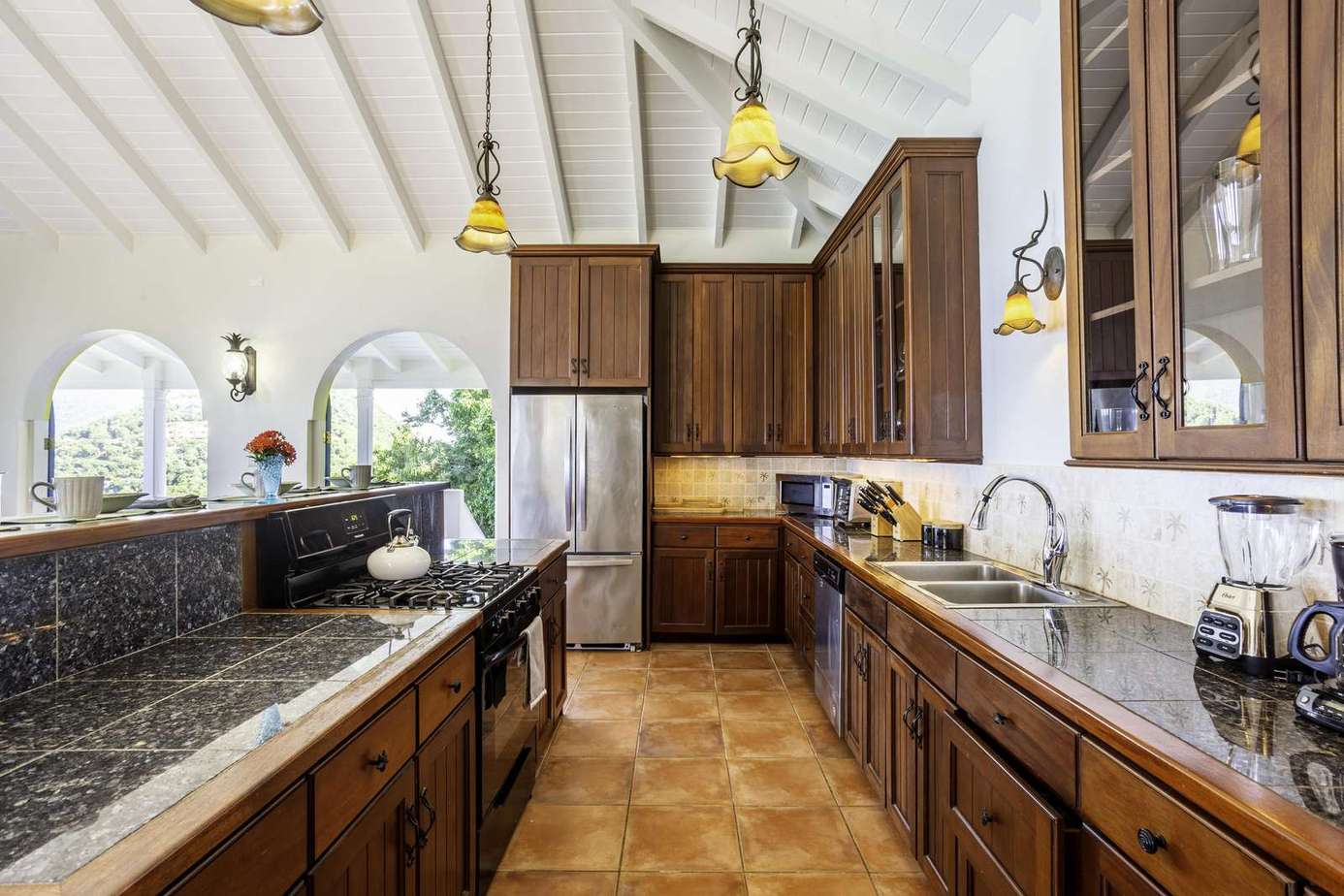 Spacious kitchen with vaulted ceilings and natural light