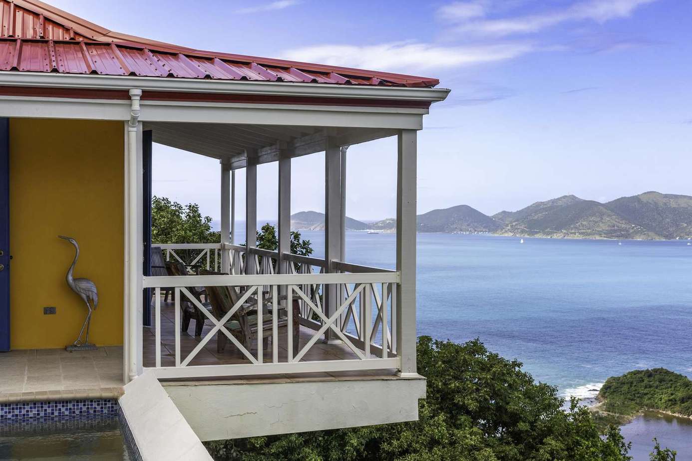 Sunlit porch with panoramic ocean and island views