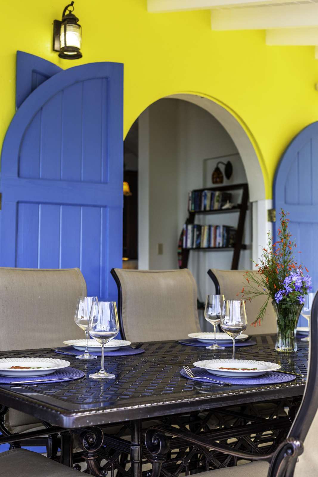 Vibrant dining area with colorful arches and cozy seating