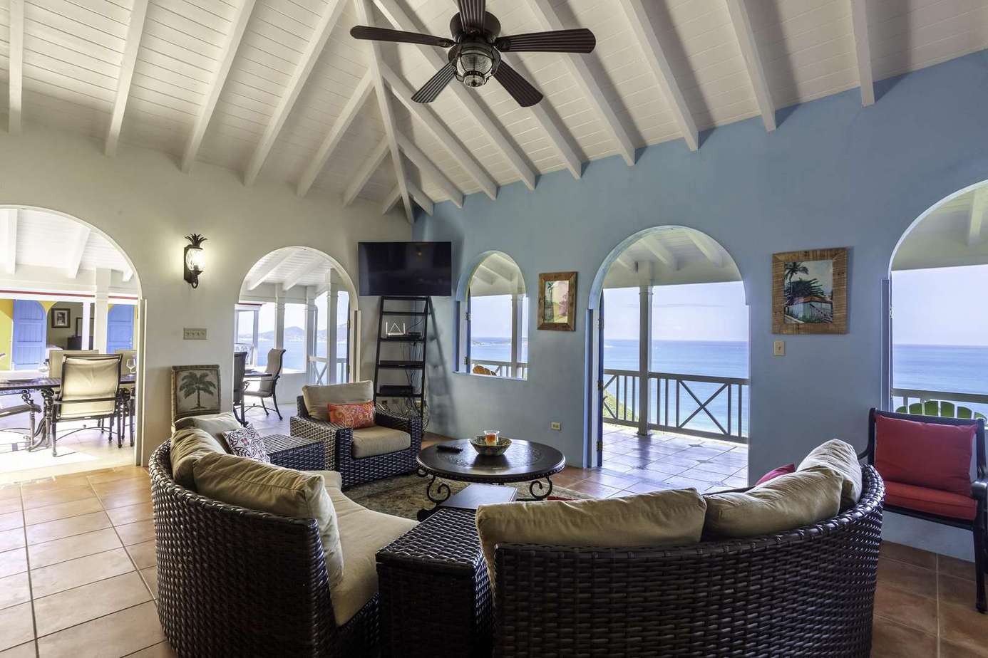 Spacious living room with panoramic ocean views and cozy seating