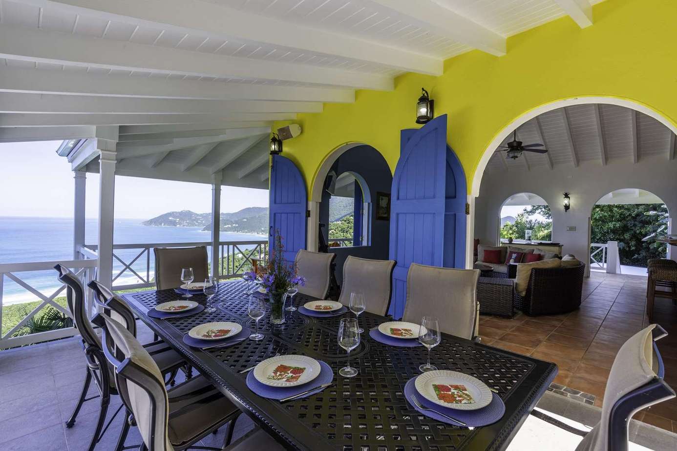 Spacious covered patio with ocean views and vibrant decor