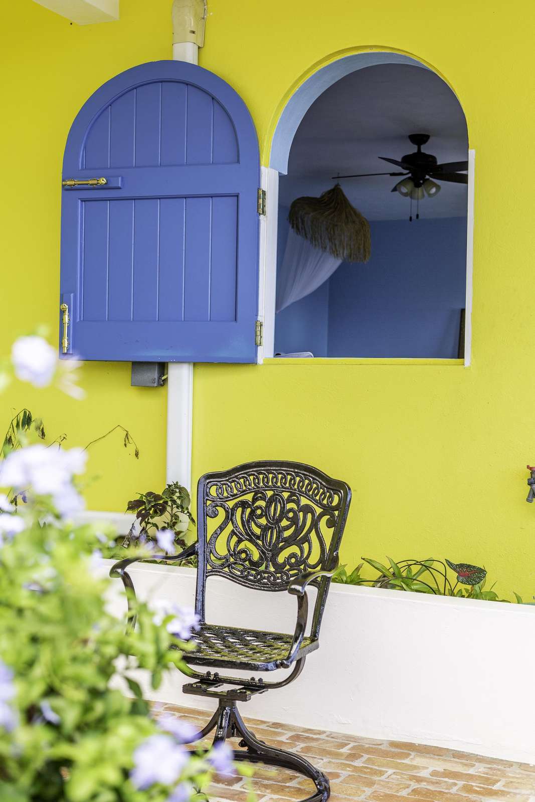 Charming patio nook with vibrant colors and cozy seating